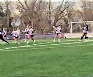 Westminster Lacrosse team plays on the field.